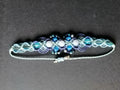 bracelet tissé a la main en micro macramé , avec des perles fluorescente et des perles en aigue marine.
